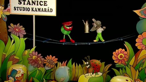 Muf a Tryskáček promazávají vlakové koleje a zpívají: „V neděli prohlížím koleje...“