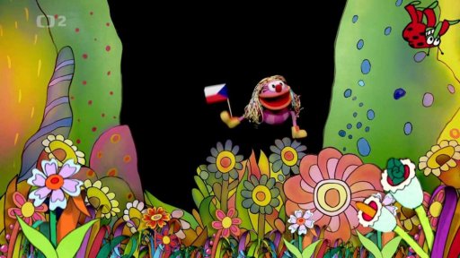 Fámula a Muf mávají dětem na rozloučenou naší vlaječkou a připomínají státní svátek.