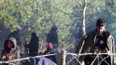 Uprchlíci na běloruské hranici s Polskem