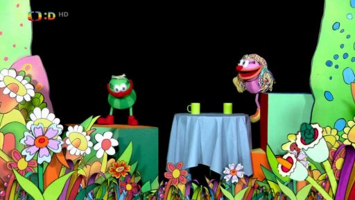 Muf chce přimět Fámulu aby se napila Zrychlovače, ta však prohodí hrnky