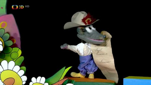 Tryskáček v převleku nutí Mufa bojovat s drakem a osvobodit princeznu. Muf se raději vzdává titulu.